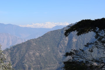 Snow covered Himalayas in the background