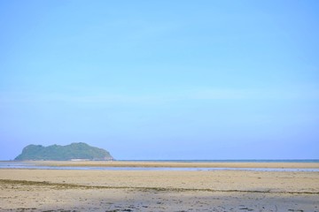 A beautiful sea beach with a mountain view and a horizontal line,blue sky  bright day in BoMao beach,Chumphon,Thailand