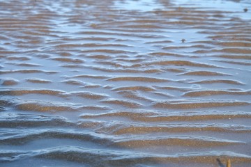 A curved pattern of beautiful sand beach for background backdrop 