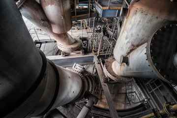 Fotobehang Interior of an old abandoned industrial steel factory © Bob