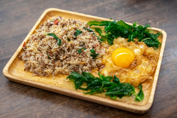 Basil fried rice mixed with minced pork and a fried egg.