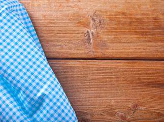 Wood texture background. Wooden table covered with blue tablecloth. View from top. Empty tablecloth for product montage for recording menu, recipe. Free space for your text