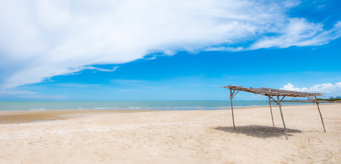 Native beach umbrellas on the beach, beautiful sea and beautiful sky. Used to shade tourists while enjoying relaxation