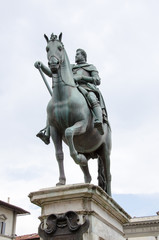 Fototapeta na wymiar Statue of Ferdinando I de' Medici at he Piazza della Santissima Annunziata in Florence, Italy 