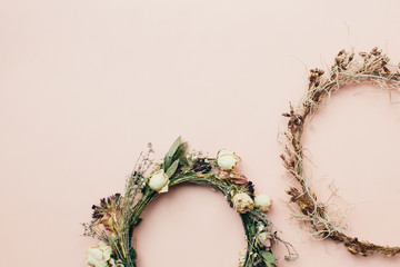 dried wreath of flowers on a pink background (wedding)