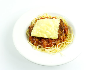 Spaghetti bolognese with cheese in a dish White  on white background, Top view, with copy space for your text.