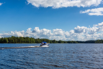 Motor boat moving on the big beautiful lake