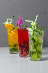 A variety of lemonades on a gray background. Refreshments