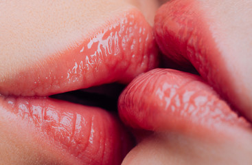 Lesbian kiss. Sensual wet female lips kissing. Lesbian pleasures. Oral pleasure. Couple girls kissing lips close up. Sensual touch kissing sexual activity. Hot foreplay. Lip care. Sex education