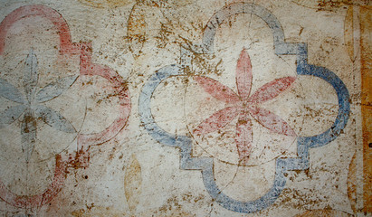 Faded Flower detail on Spanish wall. 