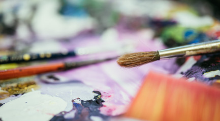 Painting artwork: paint brushes on painting background