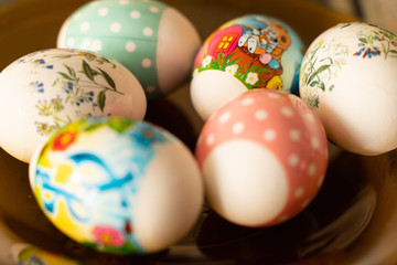 Easter eggs on a yellow plate decorated for the holiday