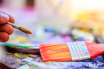 Painting artwork: paint brushes on painting background