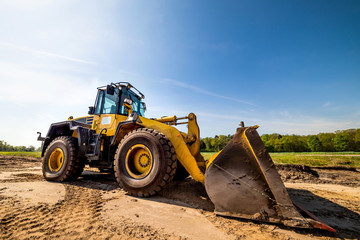Big wheel loader on a construction site