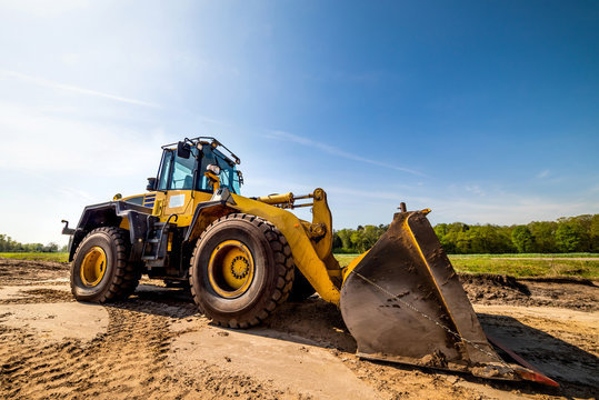 Big wheel loader on a construction site