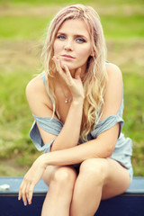 outdoor portrait of a middle aged sexy blonde woman