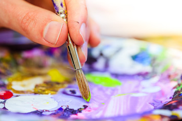 Painting artwork: paint brushes on painting background
