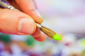 Painting artwork: paint brushes on painting background