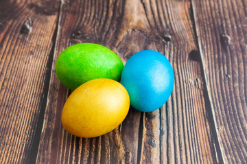 Close-up. Beautiful colorful Easter eggs. Easter concept on dark wooden background