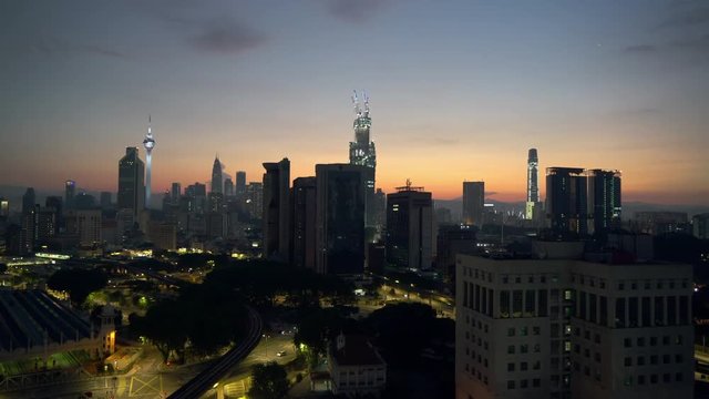 4k establishing b-roll shot of sunrise scene at Kuala Lumpur city skyline. 