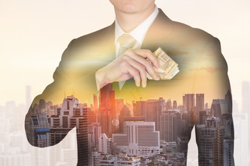 double exposure of Businessman put Euro money in his suit pocket and cityscape at sunset as business, investment, financial flexibility and saving concept.