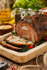 Roasted whole, stuffed with minced pork neck.
