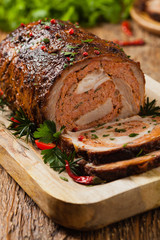 Roasted whole, stuffed with minced pork neck.