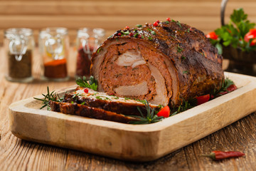Roasted whole, stuffed with minced pork neck.