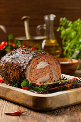 Roasted whole, stuffed with minced pork neck.