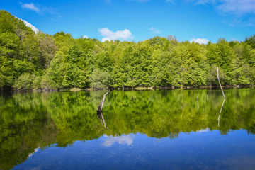 Fototapeta premium Small lake in the mountains without people in Basque Country