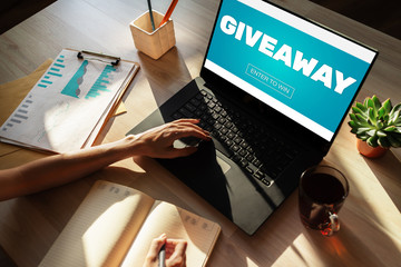 Giveaway, enter to win text on screen. Lottery and prizes. Social media marketing and advertising concept.