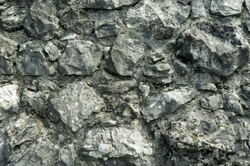 The texture of the wall of the cobblestones.