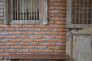 old wooden door window & brick wall