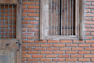Fototapeta na wymiar old wooden door window & brick wall