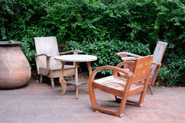 Fototapeta premium wooden table & chair in garden