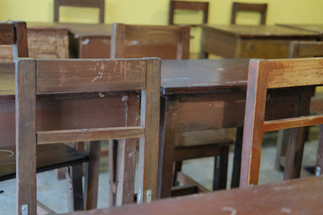 Fototapeta na wymiar old table & chair in classroom. back to school