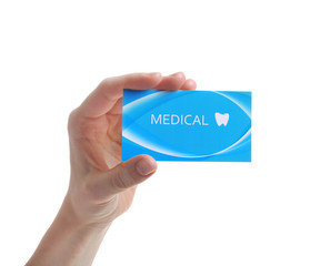 Woman holding business card isolated on white, closeup. Dental medical service