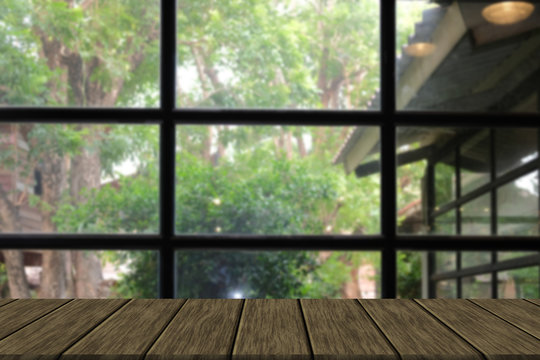 Fototapeta window with garden view with wood table for display product