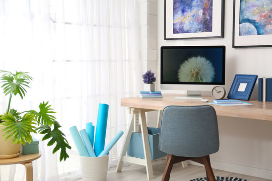 Modern workplace interior with computer on table