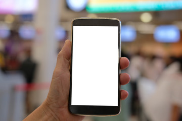 hand holding mobile smart phone at airport