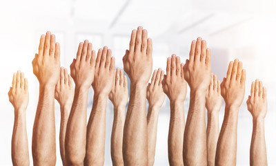 Row of man hands showing voting gesture