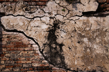Close up of isolated ancient brick walls fixed with grey mortar in Ayutthaya near Bangkok, Thailand