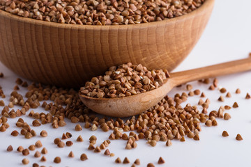 Grain buckwheat on a white acrylic background