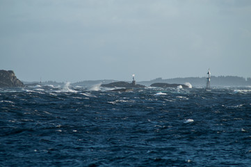 Waves in storm with rocks