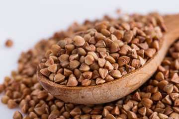 Grain buckwheat on a white acrylic background