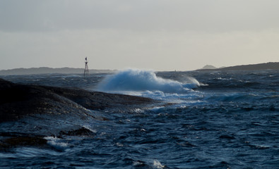 Waves in storm with rocks
