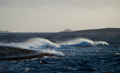 Waves in storm with rocks