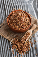 Grain buckwheat on a gray wooden background