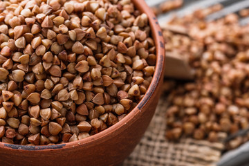 Grain buckwheat on a gray wooden background