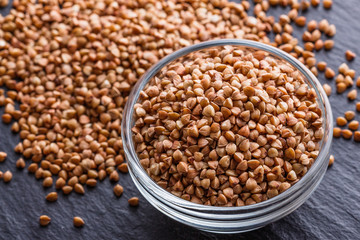 Grain buckwheat on a dark stone background